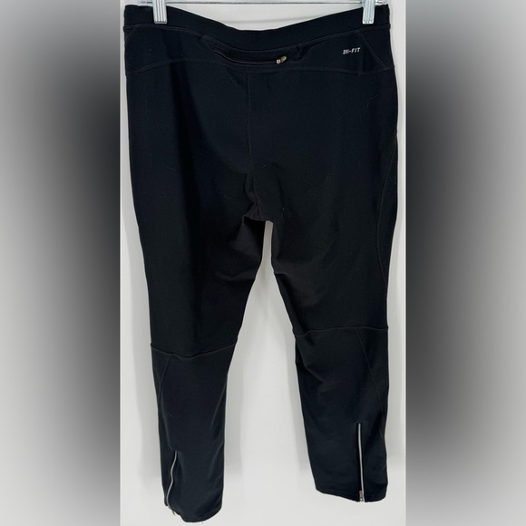 Nike Women's Dri-FIT Unlimited Zippered Cuff Versatile Pants - Picture 7 of 16